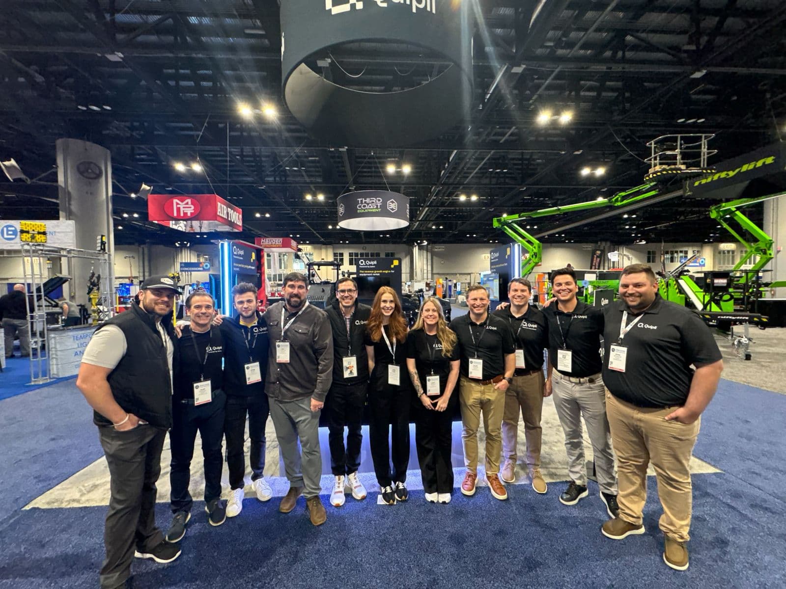 The Quipli team together on an equipment rental trade show floor