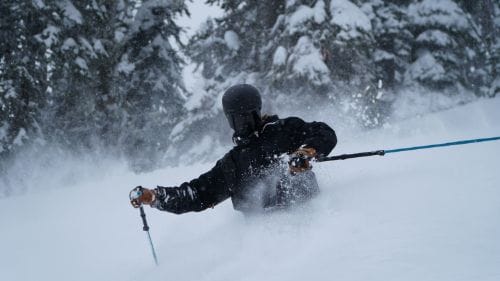 Winter sports rentals: skis and snowboards ready for customers.